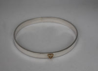 7mm wide oval bangle with 9ct gold heart