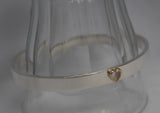 7mm wide oval bangle with 9ct gold heart